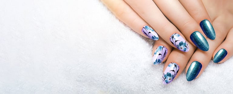 Blue flower manicure on long sharp nails with gel polish